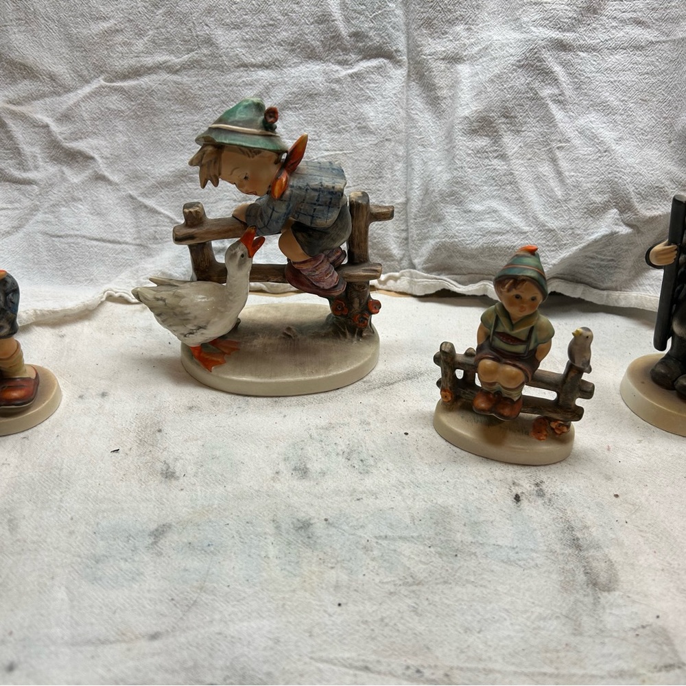 4 Hummel figurines.  One price gets you all 4. Over $700 book value.